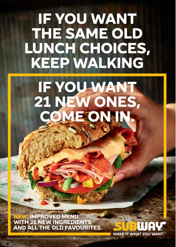 Food photography for advertising Subway advert with sandwich being held.