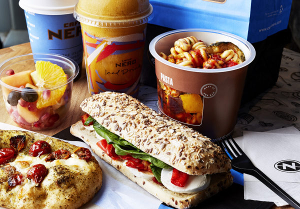 A range of lunch time products from focaccia pizza bread to classic sandwiches and pasta pots. All products are set out to represent what is available for light bites throughout the day