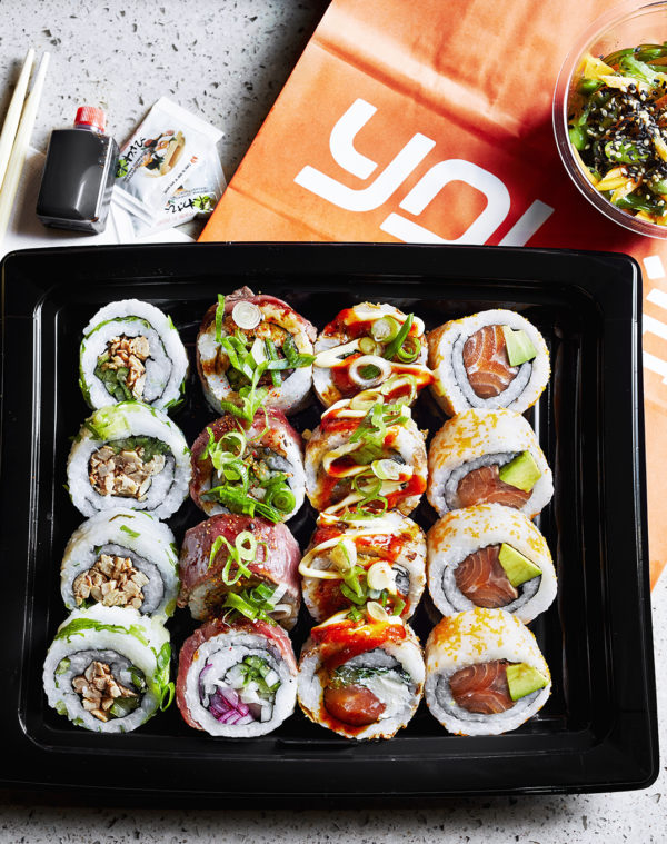 Food photography for advertising showing an example of a Yo Sushi Sharing Platter, filled with different types of sushi rolls available to share